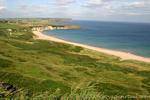 Spiaggia di White Bay, Port Braddan, Antrim Coast, Irlanda de Nord.
