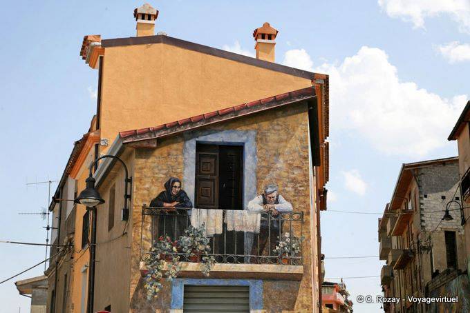 Via angolo, balcone trompe l'oeil murale Fonni - Sardegna