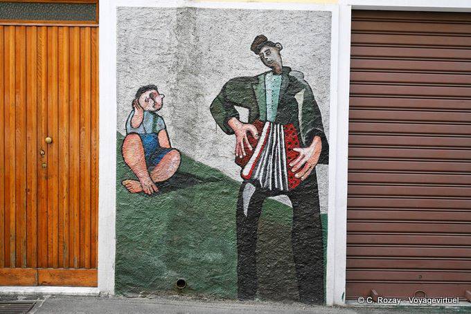 Orgosolo, fisarmonicista e bambini, murale - Sardegna