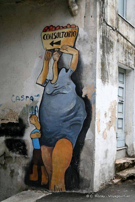 Orgosolo, Consultorio, indicazione all'angolo di Corso Repubblica, murale - Sardegna