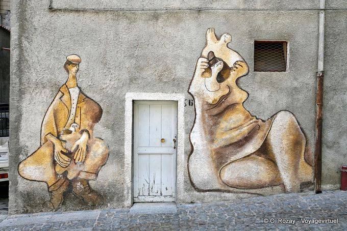 Orgosolo, storia familiare, murale sulla facciata, Via Alcide De Gasperi - Sardegna