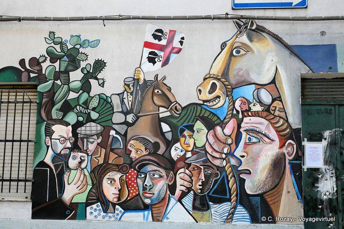 Orgosolo, i volti e il sardo bandierina, murale - Sardegna