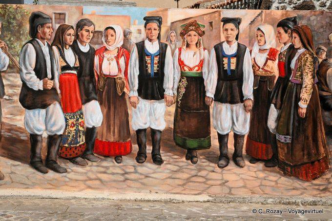 Tinnura, un gruppo folk in costume, murale Via S. Satta - Sardegna