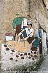 Orgosolo, uccidere il maiale, pittura naif di Via Tiziano, Sardegna.